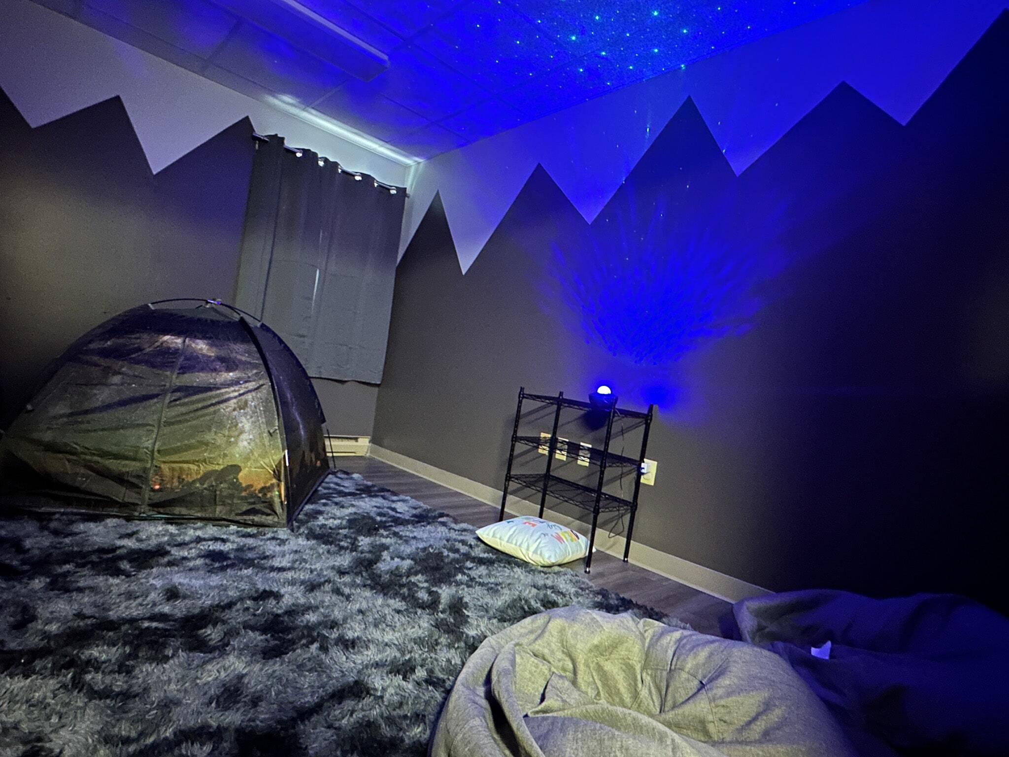 Sensory room with lighting effects and bean bag chairs in one of Wall’s ABA Clinics